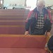 Pastor checking out the new pews